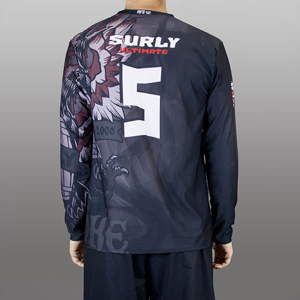 back of man wearing a black long sleeved jersey #5