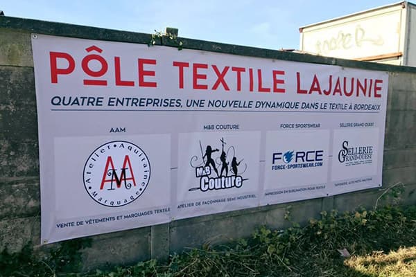 grey banner pole textile on concrete wall