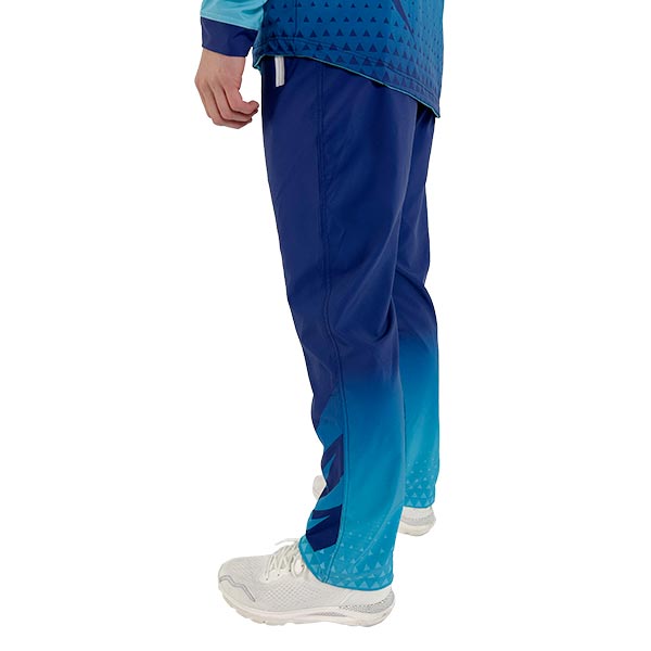 side view of the legs of a person wearing blue sublimated sports trousers