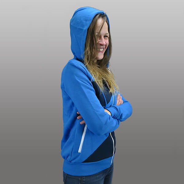 woman wearing a dark and light blue stripped hodded vest