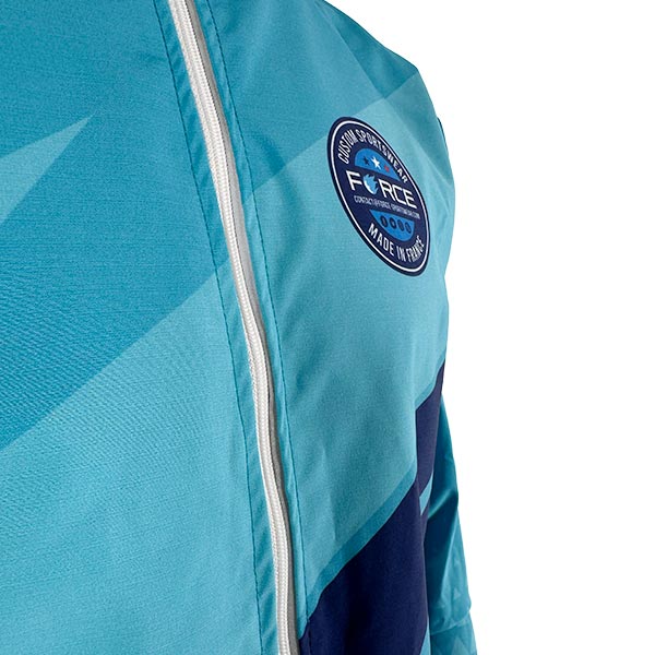 torso of a person wearing a sublimated turquoise jacket