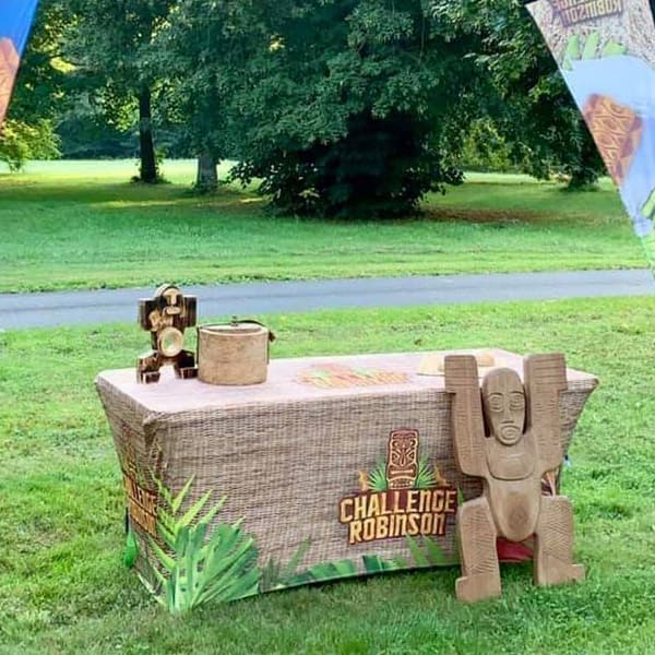table and adventure totem on grass field