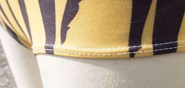 white sewing on tiger fabric